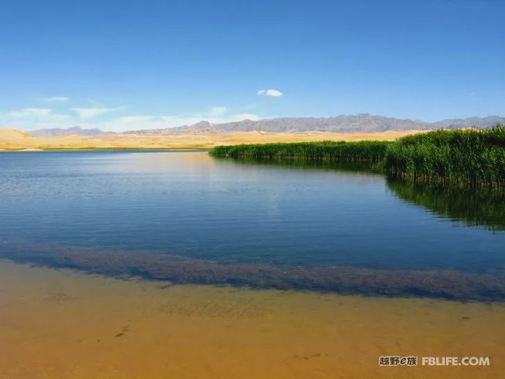 Blue sky, white clouds, clear water, vast Gobi, a bright pearl, dreamy golden world, Delingha