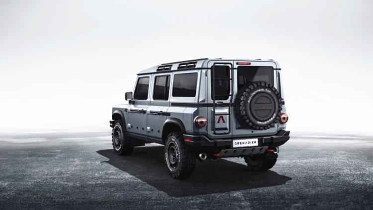 The new Land Rover Defender is the old Defender of the slag INEOS in front of it